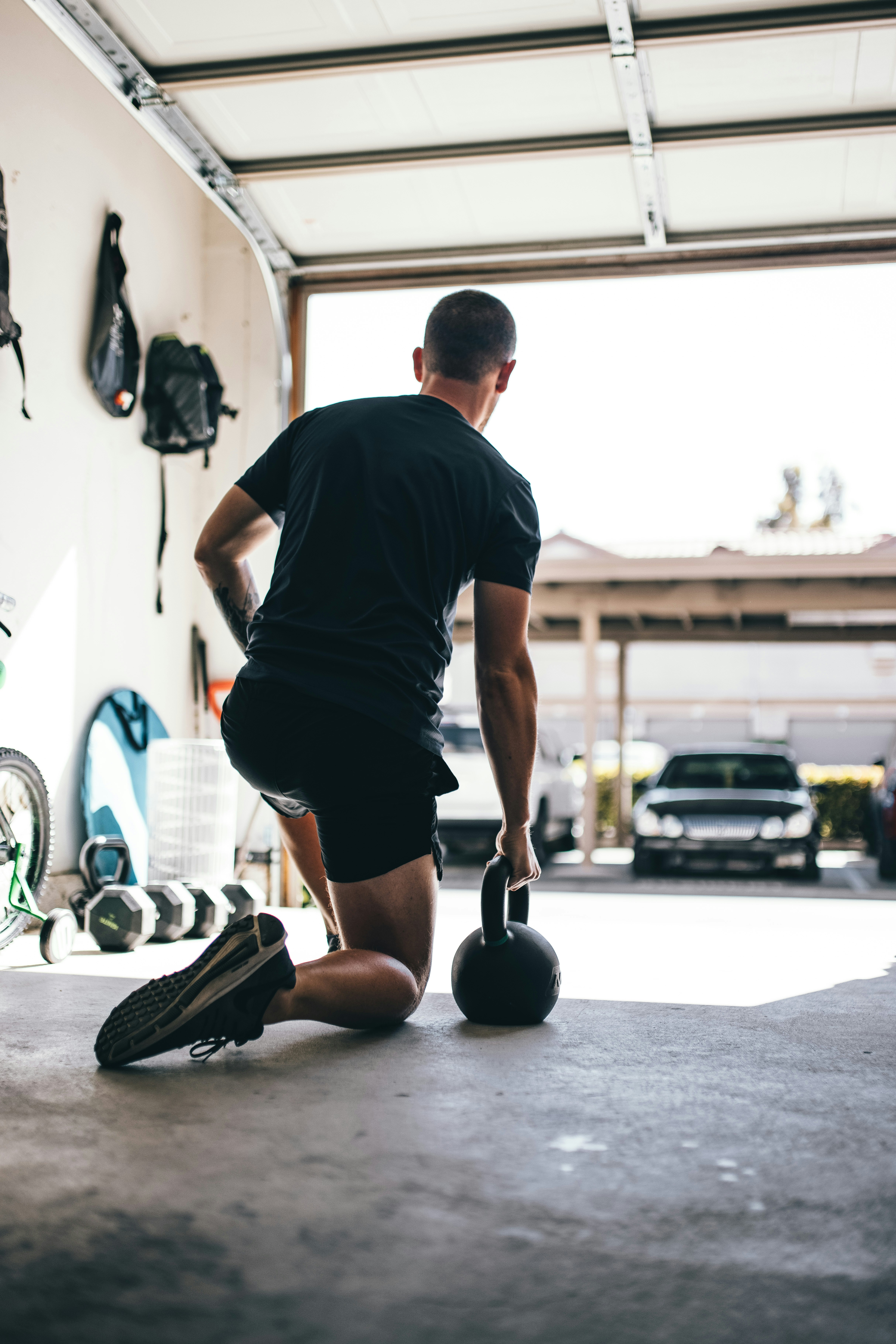 A gym's 'functional training' corner with a BOSU ball and angled cable machine — equipment marketed on real-world transfer claims that the instability-training research does not support for trained athletes.