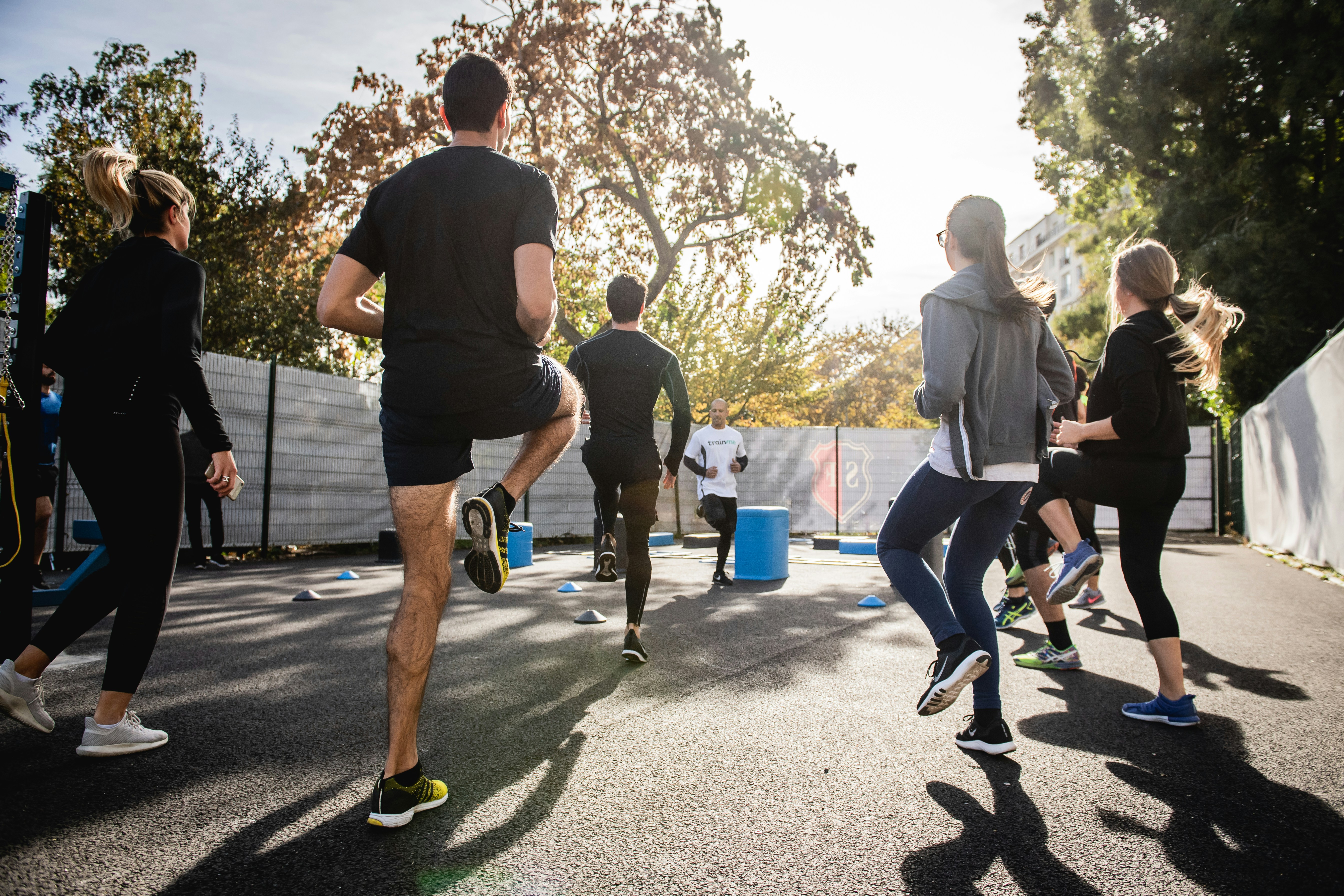 An athlete moving through a dynamic warm-up drill before training — the RAMP protocol's four phases each have a distinct physiological job, and controlled trials now show the sequence, dose, and timing of each one measurably change what happens in the session that follows.